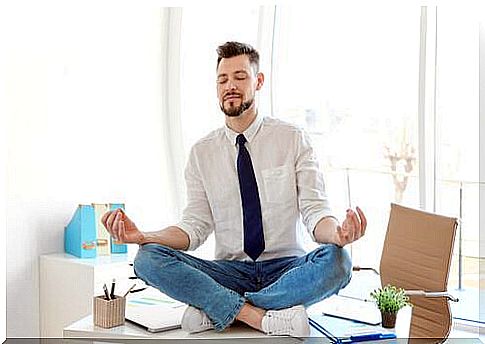 man meditating at work