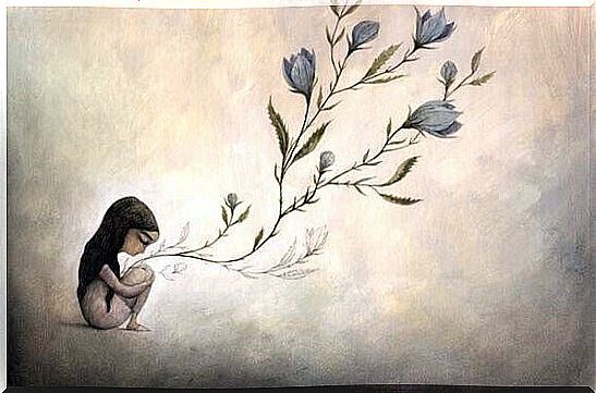 girl holding branches of flowers