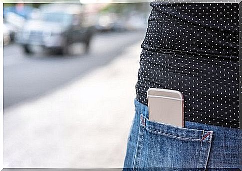 Woman with cell phone in her pocket