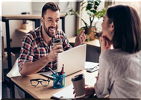 Man receiving praise from coworker