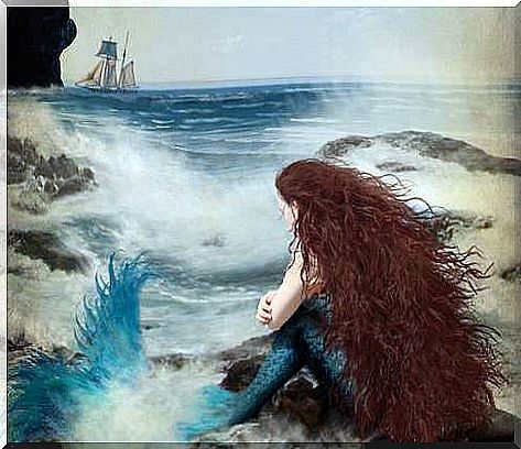 mermaid with nostalgia looking at boat