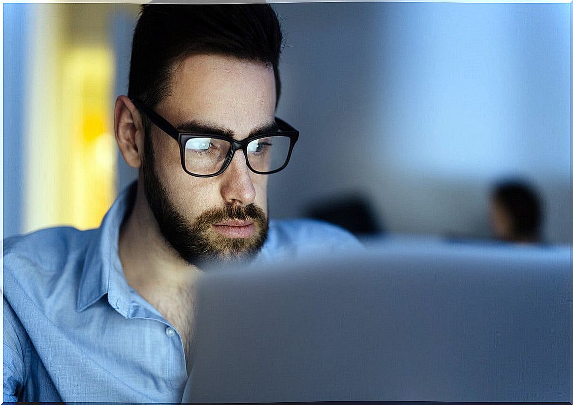 man working on the computer at night