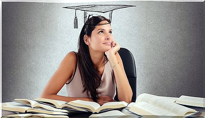 Woman studying and thinking about when to graduate.